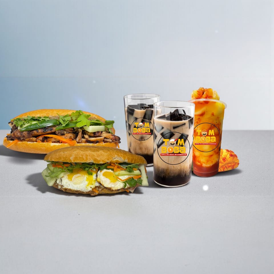Two banh mi sandwiches and three I HEART BOBA drinks, two with dark jelly, one with mango.