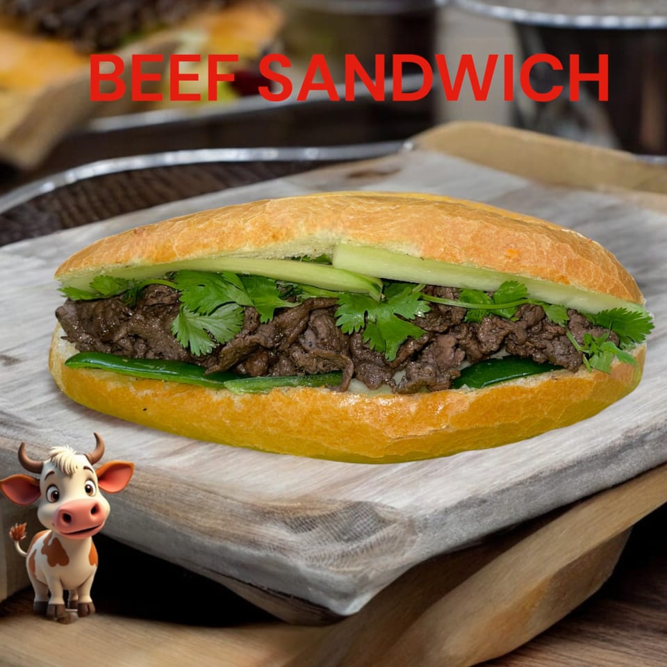 A beef sandwich with cilantro, cucumber, and jalapeños on a wooden board, with a small cow figurine.